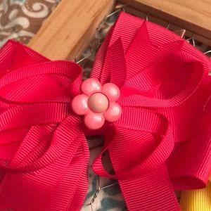 NWOT children’s berets and bows.